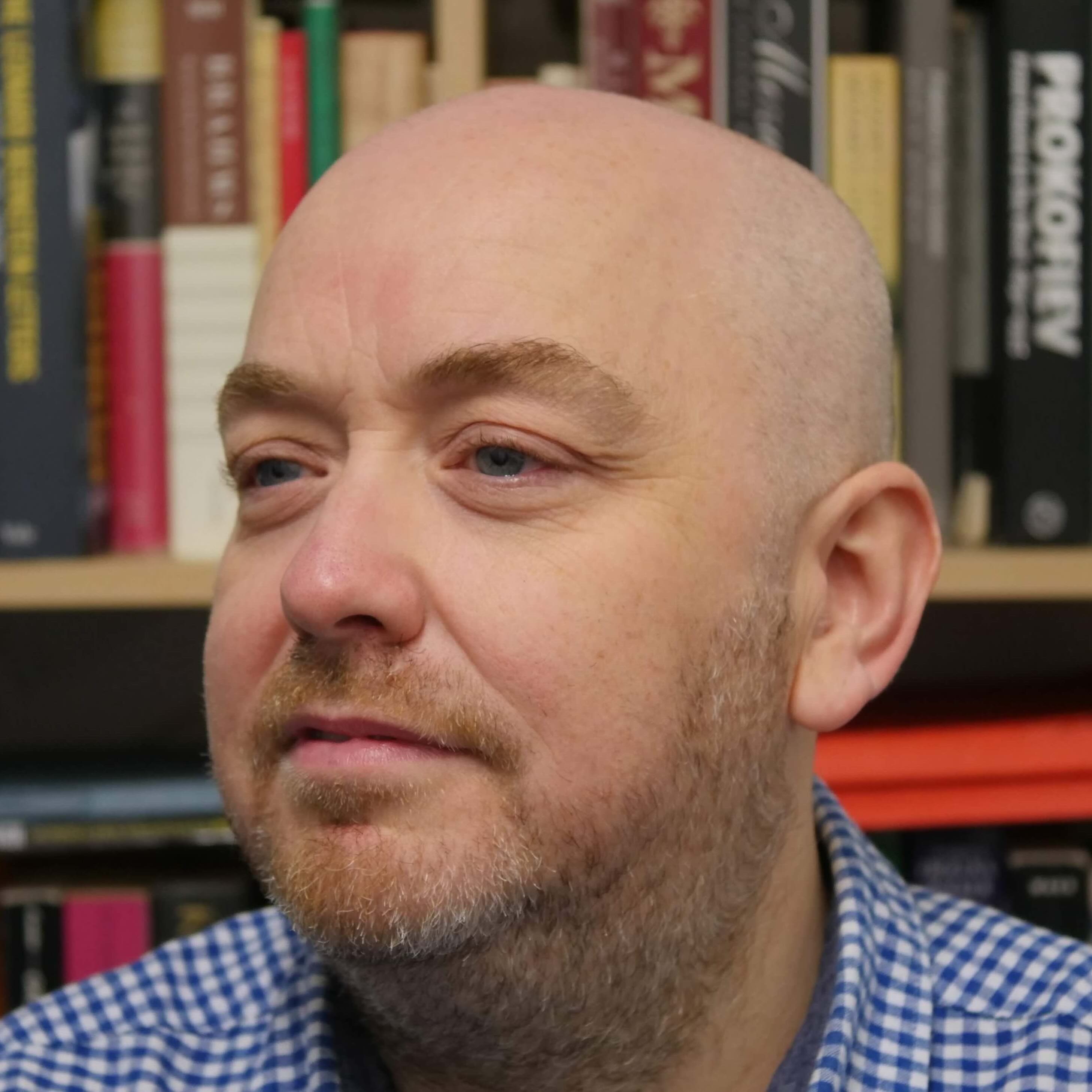 Photo of Gary by bookcase